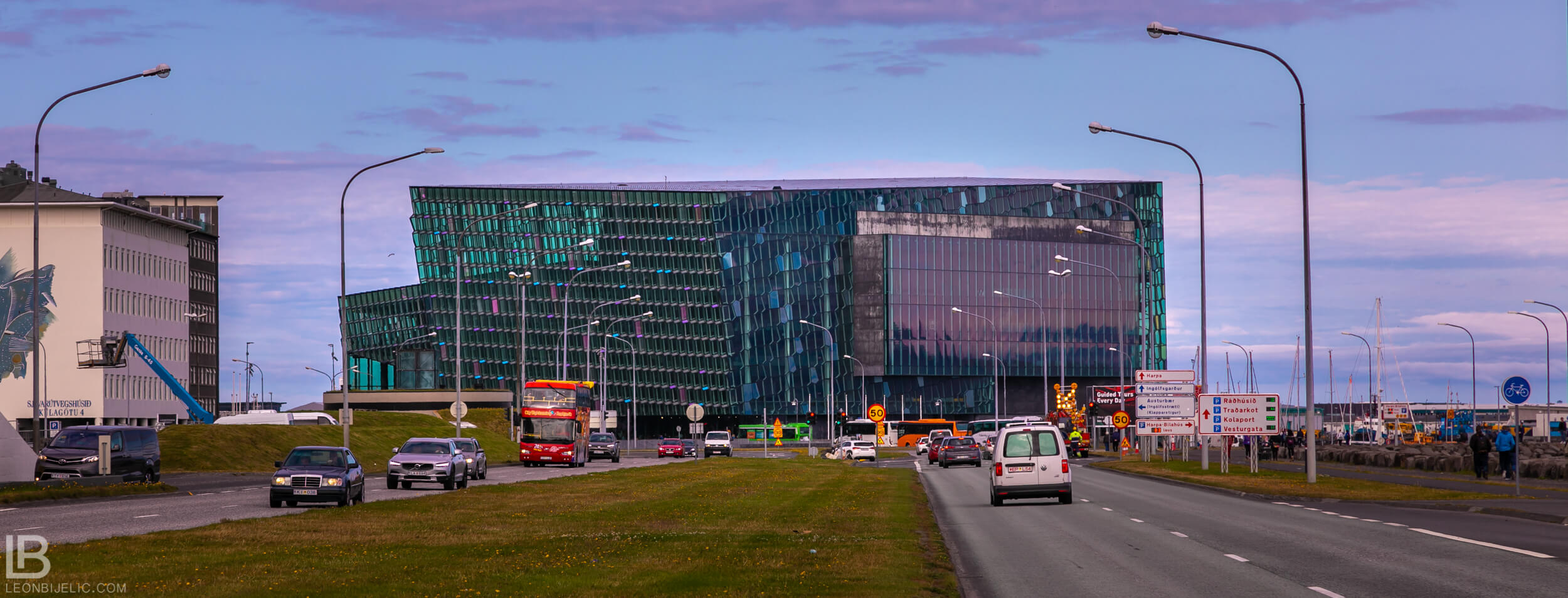 ICELAND - CAPITAL CITY REYKJAVIK - PHOTOS - SUNSET VIEW BEAUTIFUL PLANE PURPLE COLOR - the Harpa Concert Hall - Old Harbour